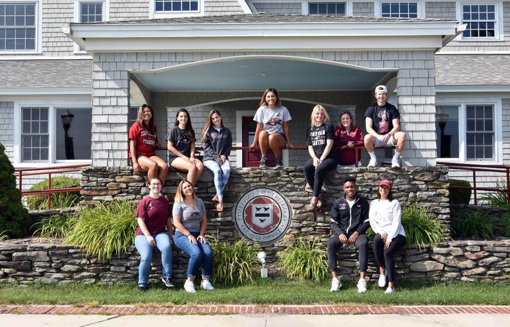 students in front of manor